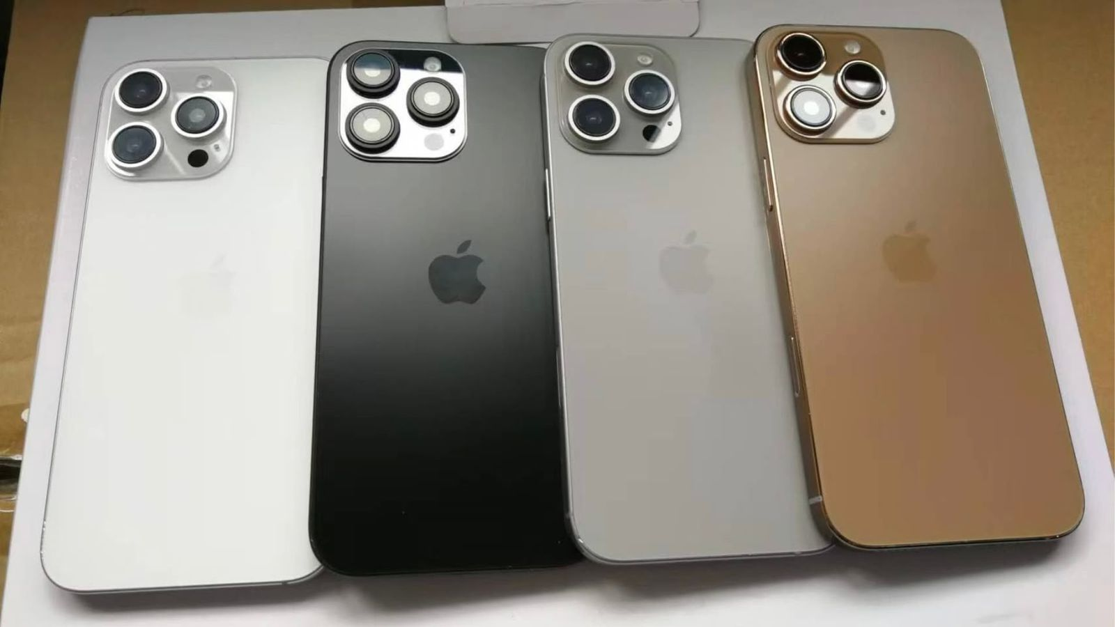 Alleged iPhone 16 Pro models in white, black, gray, and bronze